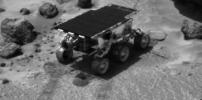 Sojourner, while on its way to the rock 'Yogi,' performed several soil mechanics experiments. Piles of loose material are seen in front of and behind the Rover. This image was taken by NASA's Imager for Mars Pathfinder (IMP). Sol 1 began on July 4, 1997.