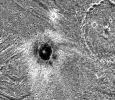 The dark-floored crater, Khensu, is the target of this image of Ganymede. The solid state imaging camera on NASA's Galileo spacecraft imaged this region as it passed Ganymede during its second orbit through the Jovian system.