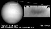 In 1995, NASA's Hubble Space Telescope discovered a new great dark spot, located in the northern hemisphere of the planet Neptune. Because the planet's northern hemisphere was tilted away from Earth, the new feature appeared near the limb of the planet.
