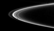 NASA's Voyager 2 obtained this picture of Saturn's F-ring on Aug. 26, 1980, just before the spacecraft crossed the planet's ring plane. This edge-on view shows nearly 25` of the F-ring, with at least four distinct components visible.