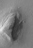 NASA's Mars Global Surveyor took this image of a low, rounded hill in southeastern Utopia Planitia on September 2, 1998.