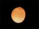 This photograph of Titan is from NASA's Voyager 2, taken Aug. 23, 1981 from a range of 2.3 million kilometers (1.4 million miles), shows some detail in the cloud systems on this Saturnian moon. 
