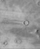 NASA's Mars Global Surveyor shows Daedalia Planum, a broad, wind-swept volcanic plain on Mars. A combination of bright surfaces (where sand and/or dust has accumulated) and dark surfaces (where sand and/or dust has been removed) are seen.