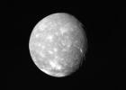 Voyager 2 obtained this full-disk view of Uranus' moon Titania in the early morning hours of Jan. 24, 1986, from a distance of about 500,000 kilometers (300,000 miles). Many circular depressions, probably impact craters, are visible in this clear-filter.