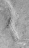 NASA's Mars Global Surveyor shows Warrego Valles, a system of discontinuous valleys located in the martian southern hemisphere south of Valles Marineris between Aonia Terra and Icaria Planum.