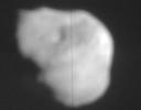 This image from NASA TV shows the nucleus of comet Tempel 1 from Deep Impact's flyby's high-resolution imager.