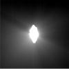 This image shows the view from NASA's Deep Impact's probe 30 minutes before it was pummeled by comet Tempel 1. The picture's brightness has been enhanced to show the jets of dust streaming away from the comet.