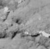 This image of the surface of comet Tempel 1 was taken about 20 seconds before NASA's Deep Impact's probe crashed into the comet on July 3, 2005. This particular region contains the impact site.