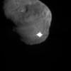 The image depicts the first moments after NASA's Deep Impact's probe interfaced with comet Tempel 1. The illuminated, and possibly incandescent, debris is expanding from the impact site.
