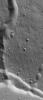 This image from NASA's Mars Global Surveyor shows a channel extending northward from the Elysium Mons caldera at the volcano's summit.