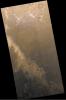NASA's Mars Global Surveyor shows dark sand exposed from beneath retreating frost on Mars' Mountains of Mitchel.