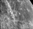 This photograph of Mercury, taken by NASA's Mariner 10, shows two prominent rayed craters. Bright halos extend as far as 2 crater diameters beyond crater rims. Individual rays extend from halo.