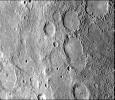 This image, from NASA's Mariner 10 spacecraft which launched in 1974, shows a broadly curved lobate scarp running from left to right in the large crater to the right of center in this image.
