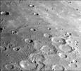 This photograph of Mercury was taken by NASA's Mariner 10 spacecraft shows smooth plains areas on Mercury that are thought to be volcanic in origin with lava flows filling in heavily cratered areas.