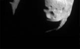 This first image of asteroid 253 Mathilde was returned by NASA's NEAR Shoemaker spacecraft on June 27, 1997. Sunlight is coming from the upper right showing a surface heavily cratered.
