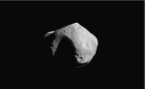 This image of asteroid 253 Mathilde was returned by NASA's NEAR Shoemaker spacecraft on June 27, 1997. The shadowed, wedge-shaped feature at the lower right is another large crater viewed obliquely.