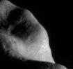 This image of asteroid Eros, taken by NASA's NEAR Shoemaker on March 6, 2000, shows the southwestern part of the saddle region with fragments of Eros' native rock, shattered over the eons by formation of impact craters.