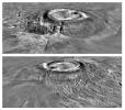 NASA's Mars Global Surveyor shows views of Arsia Mons, the southern most of the Tharsis montes on Mars featuring the caldera structure and the flank massive breakout that produced a major side lobe.