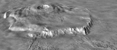 NASA's Mars Global Surveyor shows Olympus Mons on Mars featuring the volcano's scarp and massive aureole deposit that was produced by flank collapse.