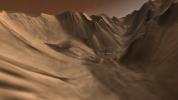 Viewers experience roller-coaster twists and turns as they fly up a winding tributary valley that feeds into Valles Marineris, the 'Grand Canyon of Mars.' This image was taken by NASA's 2001 Mars Odyssey.