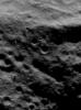 This image of asteroid Eros, taken by NASA's NEAR Shoemaker on June 6, 2000, shows a landscape textured by low ridges and grooves running from left to right, with numerous boulders sprinkled on them.