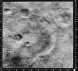 This image from NASA's Mariner 4 shows the crater named after it. A linear ridge runs through the bottom of the crater which is part of Sirenum Fossae on Mars.