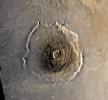 Color mosaic of Olympus Mons volcano on Mars from NASA's Viking 1 Orbiter. The mosaic was created using images from orbit 735 taken 22 June 1978. Olympus Mons is about 600 km in diameter and the summit caldera is 24 km above the surrounding plains.