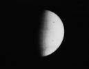 NASA's Mariner 9 took this picture of Mars on November 11, 1971, during its approach to the planet. The south polar cap (at the bottom of the planet disc) shines dimly through the apparent atmospheric haze, probably dust.