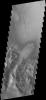 This image from NASA's 2001 Mars Odyssey spacecraft shows a large portion of etched terrain near the south pole of Mars.