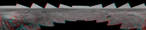 Before moving on to explore more of Mars, NASA's Mars Exploration Rover Spirit looked back at the long and winding trail of twin wheel tracks the rover created to get to the top of 'Husband Hill.' 3D glasses are necessary to view this image.