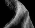 This image of asteroid Eros, taken by NASA's NEAR Shoemaker on Sept.26, 2000, shows a broad, curved depression that stretches vertically across the image is an area of the asteroid.