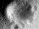 This image of asteroid Eros taken on Sept. 10, 2000, by NASA's NEAR Shoemaker shows a feature known as Psyche, the largest crater on Eros. Its smaller sister craters align its rim and create a paw-like appearance.