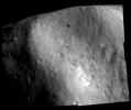 This image of asteroid Eros, taken by NASA's NEAR Shoemaker shows the boulder-filled, concave depression at the southwestern edge of the saddle-shaped Himeros.