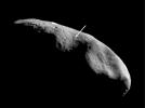 This image of peanut-shaped asteroid Eros, taken by NASA's NEAR Shoemaker on Dec. 3, 2000, shows the terminator (the imaginary line dividing day from night) which lies near the equator.
