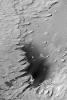 NASA's Mars Global Surveyor shows layered rock outcrops reaching deep down into the martian crust in the walls of the Valles Marineris. 