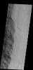 The eastern margin of Tharsis Tholus on Mars is visible on the left side of this image as seen by NASA's 2001 Mars Odyssey spacecraft.