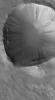 NASA's Mars Global Surveyor shows a dust-mantled crater in central Arabia Terra on Mars. Light and dark slope streaks have formed on the crater walls, as dry dust has slid down the slopes.