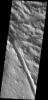 Dust slides are common in the dust covered region called Lycus Sulci on Mars. A large fracture is also visible in this image as seen by NASA's 2001 Mars Odyssey spacecraft.