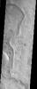 The ancient sinuous river channel shown in this image by NASA's Mars Odyssey spacecraft was likely carved by water early in Mars history. Auqakuh Valles cuts through a remarkable series of rock layers that were deposited and then subsequently eroded.