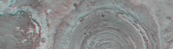 This anaglyph from NASA's Mars Global Surveyor shows a circular feature in northern Terra Meridiani. The circular feature was once an impact crater. 3D glasses are necessary to view this image.