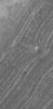 NASA's Mars Global Surveyor shows a small, relatively light-toned knob of layered material, and the erosional expression of the underlying layers, in the south polar region of Mars. 