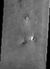 This image from NASA's Mars Odyssey spacecraft of the northern plains of Mars shows a surface texture of hundreds of small mounds and numerous small impact craters.