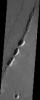 These pit-chain features in this NASA Mars Odyssey image of south Noctis Labryinthus are oriented parallel to grabens in the area, suggesting that tensional stresses may have been responsible for their formation.