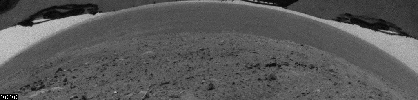 This image shows dust devils moving across the plain inside Mars' Gusev Crater, as seen with a hazard-identification camera on NASA's Mars Exploration Rover Spirit on July 29, 2005.