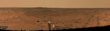 This approximate true-color panorama was taken by NASA's Spirit rover after it successfully trekked to the top of 'Husband Hill,' in the 'Columbia Hills' of Gusev Crater. The rover left tracks to the left point toward the west.