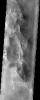 This somewhat cloudy image from NASA's Mars Odyssey spacecraft shows a stunning example of layered deposits in Terby crater, just north of the Hellas impact basin.