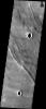 This image taken by NASA's 2001 Mars Odyssey shows strange-looking grooved terrain overlies lava flows off of the western flank of the giant shield volcano Arsia Mons on Mars.