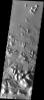 This image taken by NASA's 2001 Mars Odyssey showing large, tilted blocks of chaotic terrain in Masursky Crater on Mars. Chaotic terrain is thought to occur when subsurface water is suddenly released to the surface.