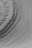 NASA's Mars Global Surveyor shows layered sedimentary rocks in southern Galle Crater on Mars.