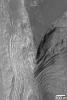 NASA's Mars Global Surveyor shows Terby Crater, a basin just north of Hellas Planitia on Mars. Sedimentary rocks are eroded and exposed.